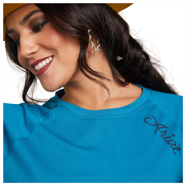 10043411 Ariat Women's Ropey Shield Long Sleeve Graphic Tee - Mosaic Blue